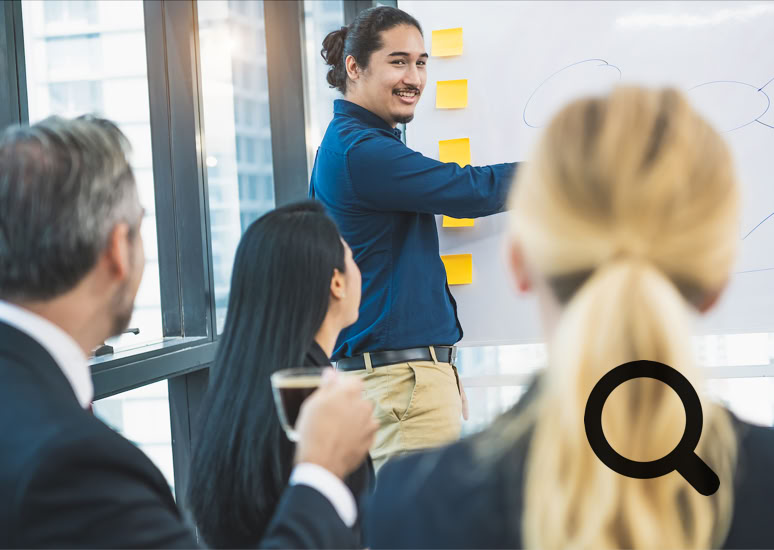 A colleague presenting a report to colleagues